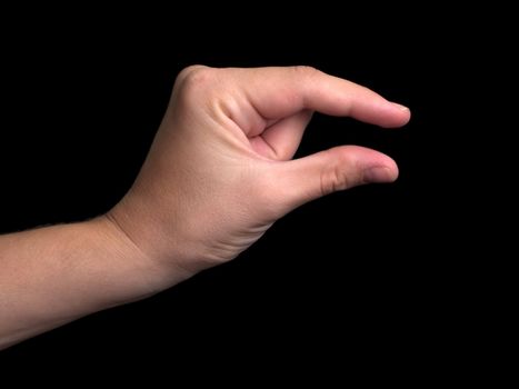 Human hand pinching finger  sign isolated on black