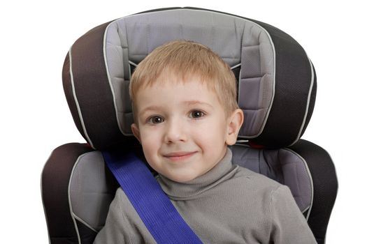 Little child on vehicle car safety seat with belt