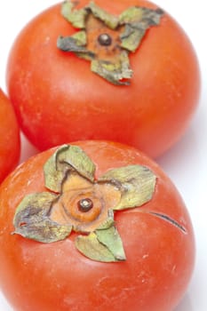 Orange persimmons isolated on white background