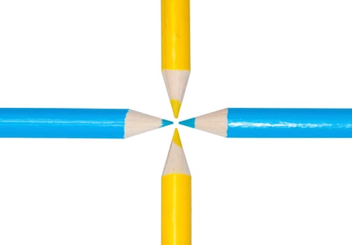 blue and yellow pencils arranged in a cross isolated on white