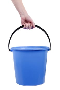 Human hand holding empty plastic bucket container