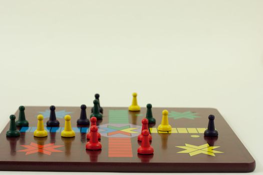 a Front view of a parcheesi borad with a game ready to play