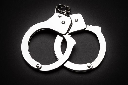 Crime law arrest police steel handcuffs isolated