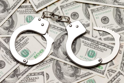 Crime law handcuffs arrests paper dollars currency