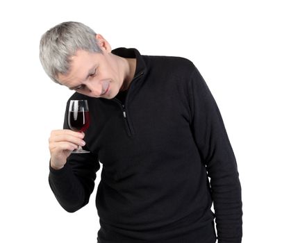 Man looks at a glass of red port wine, on white background