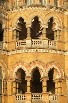 ornamental staircase in sunset light - detail of facade of Victoria Railway station in Mumbai, UNESCO World Heritage Site, India