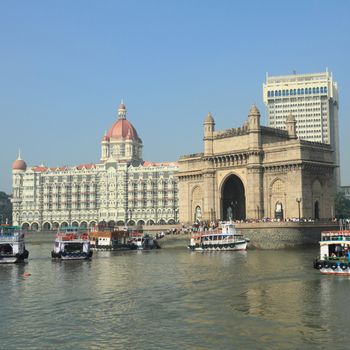 Famous landmarks of Bombay - Gate of India and Taj Mahal Hotel - seen from the sea, India
