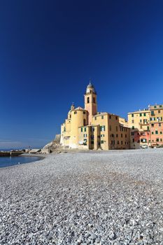 beach and church in Camogli, famous small town in Mediterranean sea, Italy