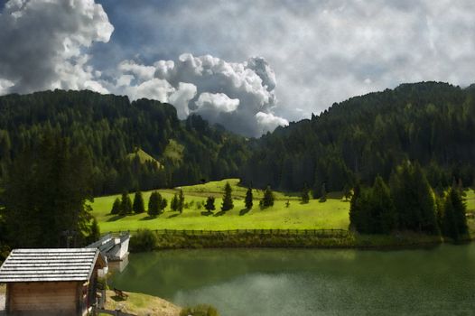 picture of the small alpine lake of the Italian Dolomites