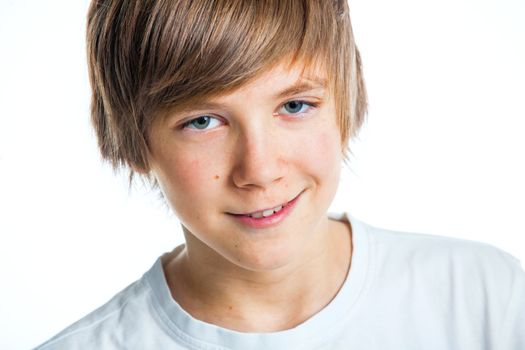 Close up portrait of young smiling cute teenager in white, isolated on white