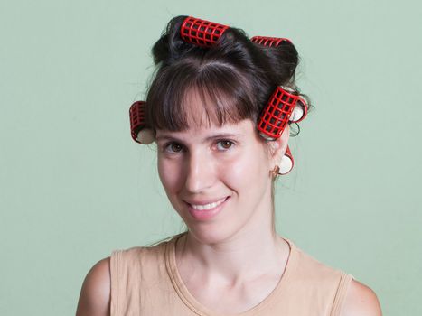 Curlers hair roller on adult beauty women