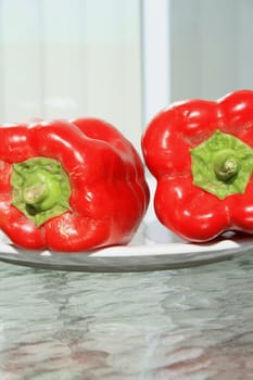 Close up of the red bell peppers on a plate.
