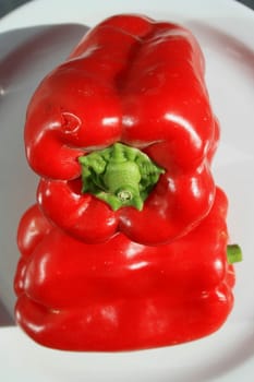 Close up of the red bell peppers on a plate.
