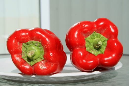 Close up of the red bell peppers on a plate.
