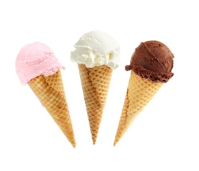 Assorted ice cream in sugar cones isolated on white background