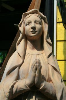Close up of a statue of a Virgin Mary.
