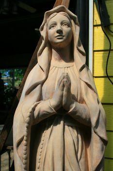 Close up of a statue of a Virgin Mary.
