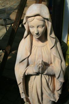 Close up of a statue of a Virgin Mary.
