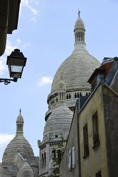 Sacre-Coeur Basilica's dome view from an alley