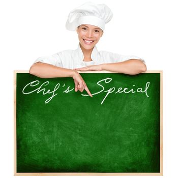 Chef menu sign blackboard with copy space for menu items. Beautiful young woman chef holding showing blank chefs special restaurant menu chalkboard isolated on white background. Multiracial Chinese Asian / Caucasian female cook or chef.