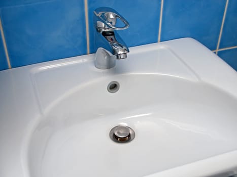 Clean sink and faucet at home toilet or bathroom