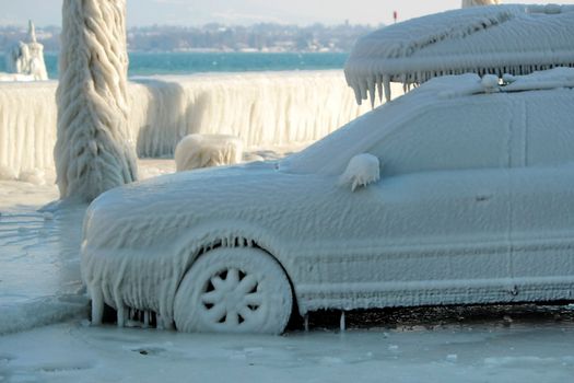 Car imprisonned in the ice because of low winter temperatures and waves, Versoix, Switzerland