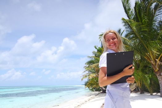 business woman on ocean coast on the background of a palm trees and sky and sea