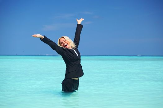 business woman stay in ocean waves