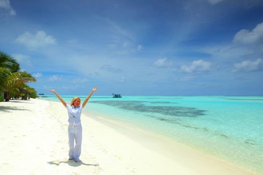 happy  business woman on the desolate ocean coast