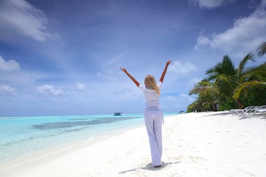 happy  business woman on the desolate ocean coast