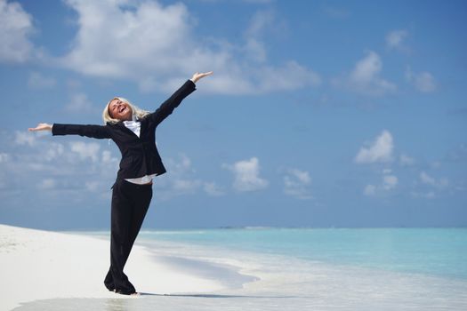 happy  business woman on the desolate ocean coast