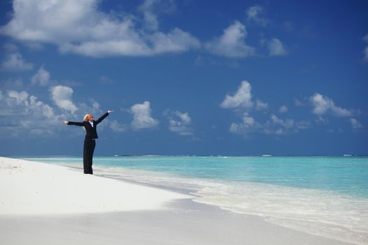 happy  business woman on the desolate ocean coast