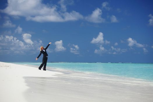 happy  business woman on the desolate ocean coast