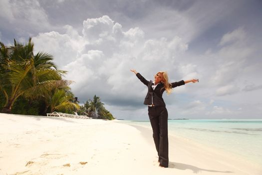 happy  business woman on the desolate ocean coast