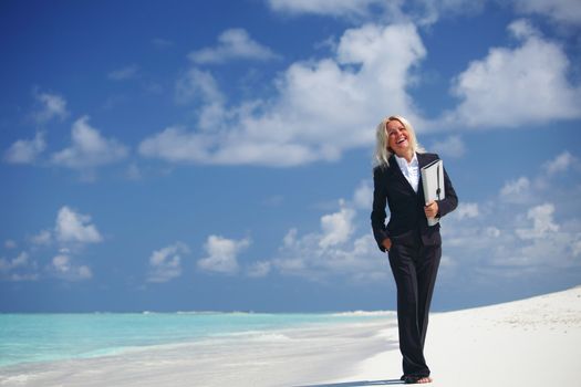 happy  business woman on the desolate ocean coast