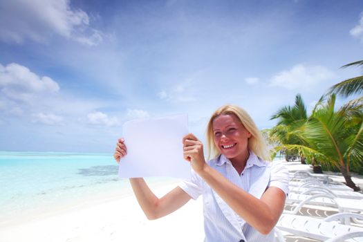 business woman with blank paper on the desolate ocean coast