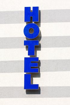 Business travel vacation blue neon city hotel sign