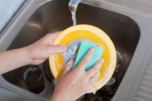 Cleaning dishware kitchen sink sponge washing dish