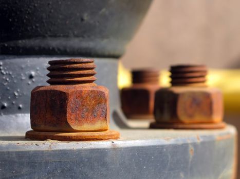 Old rusty metal nut on iron water valve