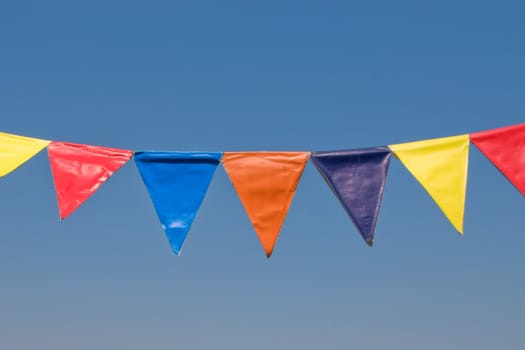 Bright color banner flag on blue background