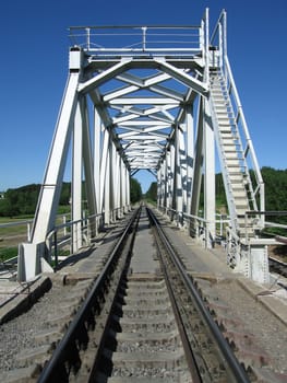 Train truck and railroad bridge on river