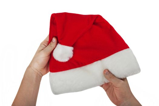 Hand holding Christmas holiday red Santa Claus hat