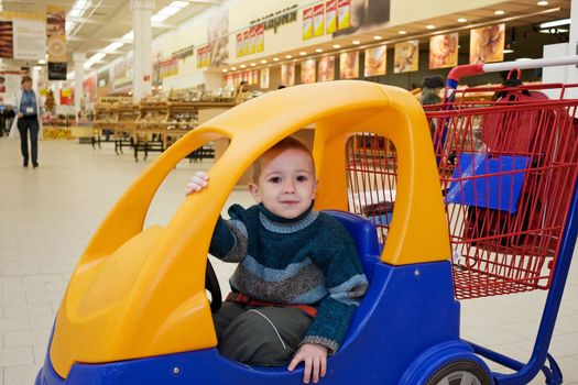 Supermarket store little child shopping cart car