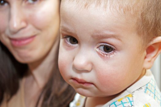 Smiling mother and little child - family happiness