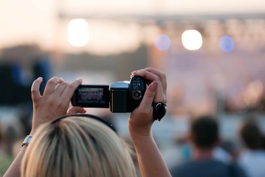 Human home video - adult women holding lens camera