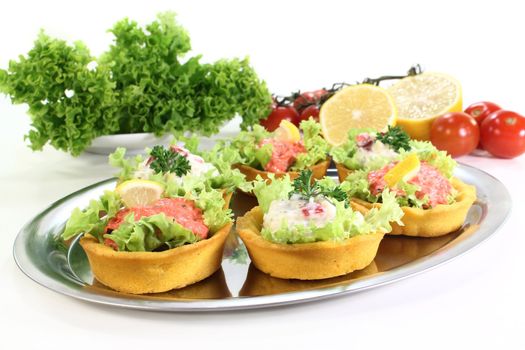 Corn cakes with different fillings and salad