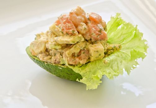 Fresh salad with shrimps, salmon and avocado