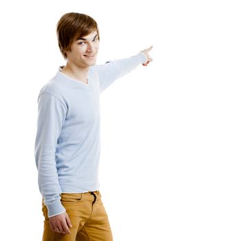 Young man showing something and pointing, isolated on white background