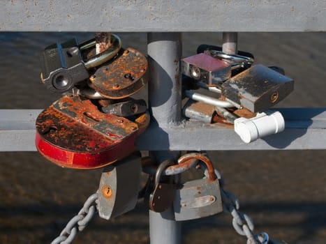 Closed wedding padlock on bridge - symbol of love