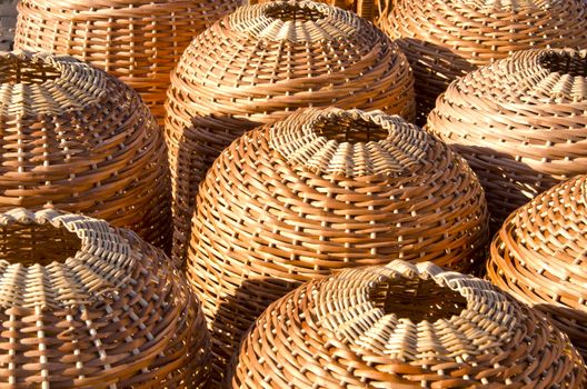 Wicker handmade wooden basket sell in outdoor city street market fair.